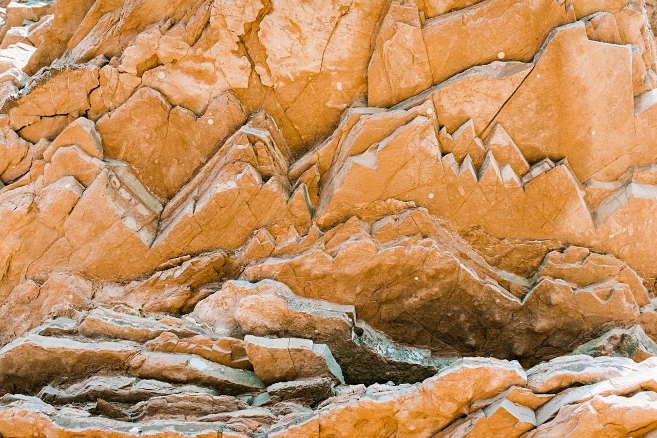 Detailed view of an eroded rock face with geometric patterns and textures.